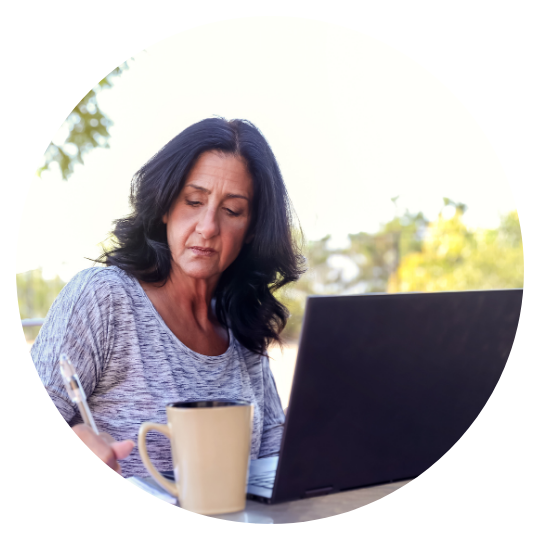 lady sitting outside on a computer